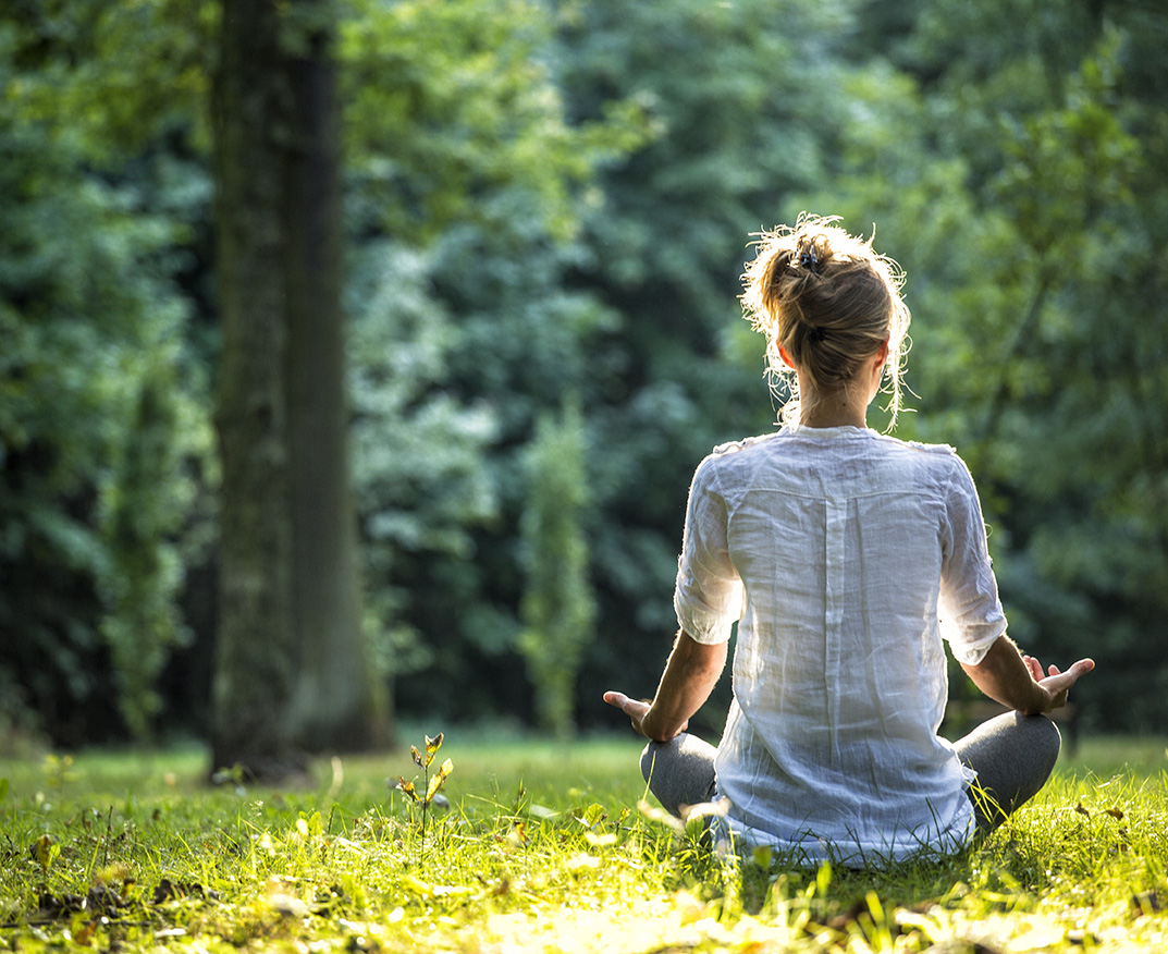 Woman in nature, relaxing in sunlight, spring cleaning carpet cleaning offer